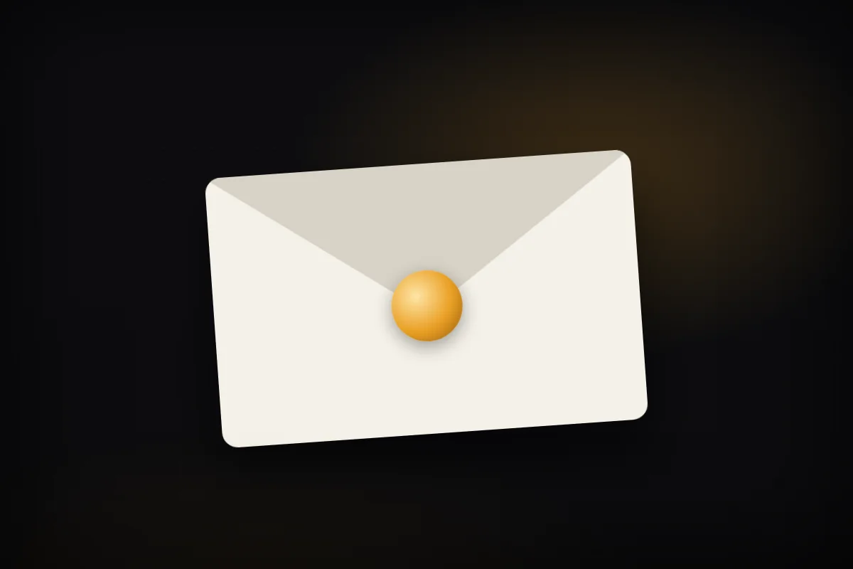 A single cream envelope on a dark surface, lit from one side